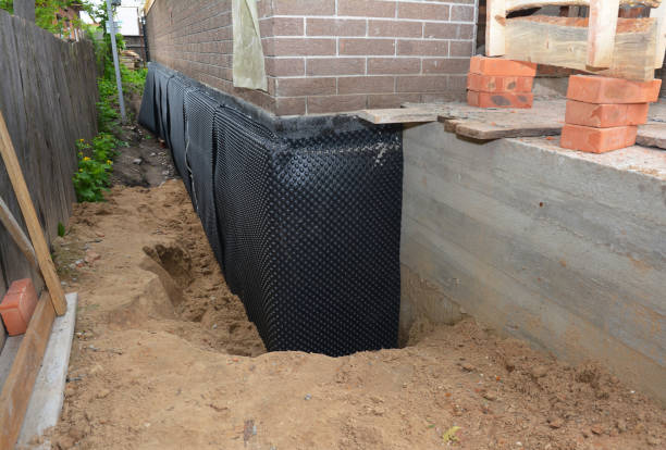 Happy homeowners after waterproofing job in Marshall